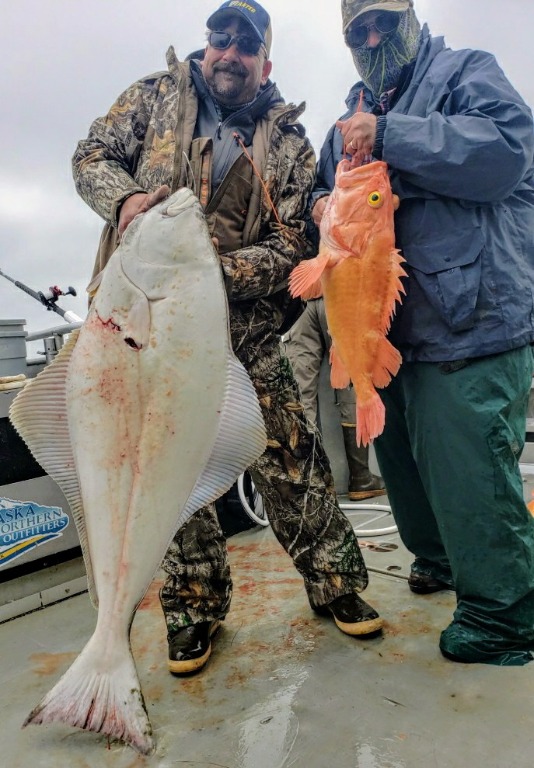 Dan Saul & his fishing buddy Bob Maier in Alaska in 2020. Dan caught this Yellow eyed rock fish and a 110# Halibut. Bob is holding a 90# Halibut.